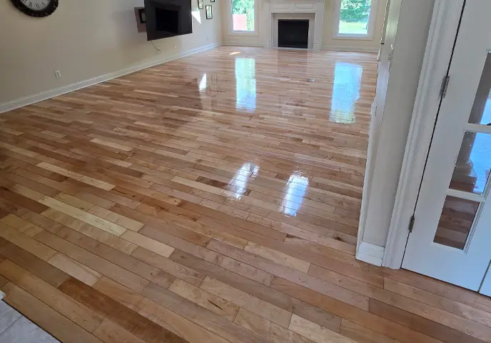 Residential property in Evansville Ind. main living space had the maple wood refinished to look new again